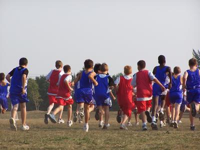 Students running in a field